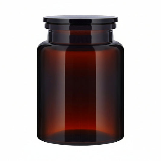 The Wetherby Amber Glass Storage Jar – large apothecary-style jar in translucent amber glass with wide-mouth design, styled for bath salts, cotton pads, or basin-side essentials.