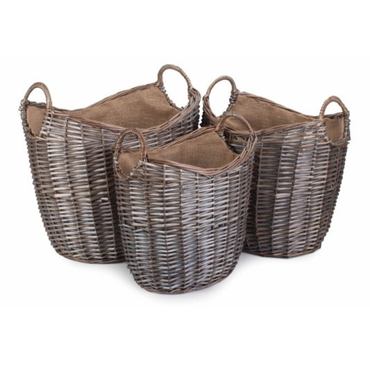 Wicker log baskets with hessian lining — rustic fireside storage, timeless countryside charm.