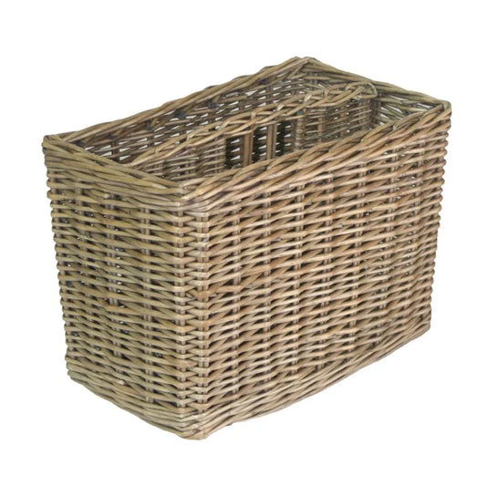 Empty antique wicker magazine rack with slanted sides and woven design on white background