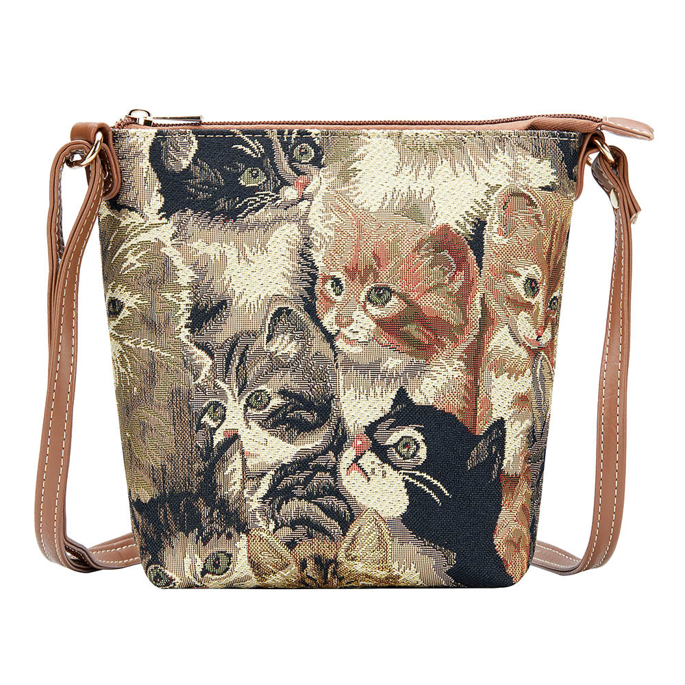 Cat tapestry sling bag worn on a countryside walk, compact crossbody style with adjustable strap UK