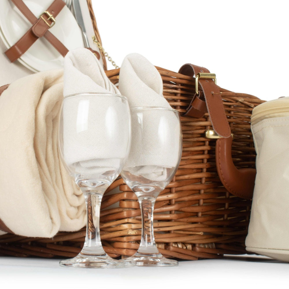 Close‑up of picnic glasses included with deluxe wicker basket for two, displayed on plain background