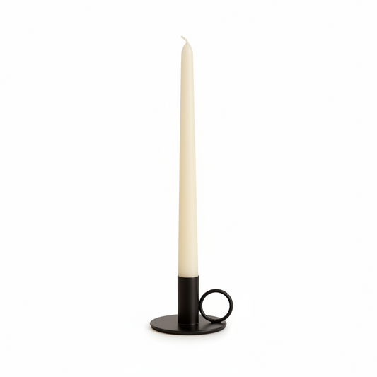 Black iron candle holder with white taper candle product shot UK