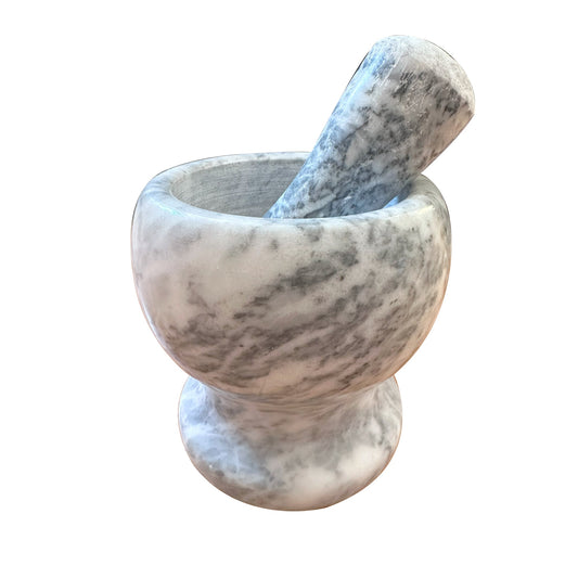 Grey-white polished marble pestle and mortar, classic kitchen tool for grinding herbs, spices, and salts