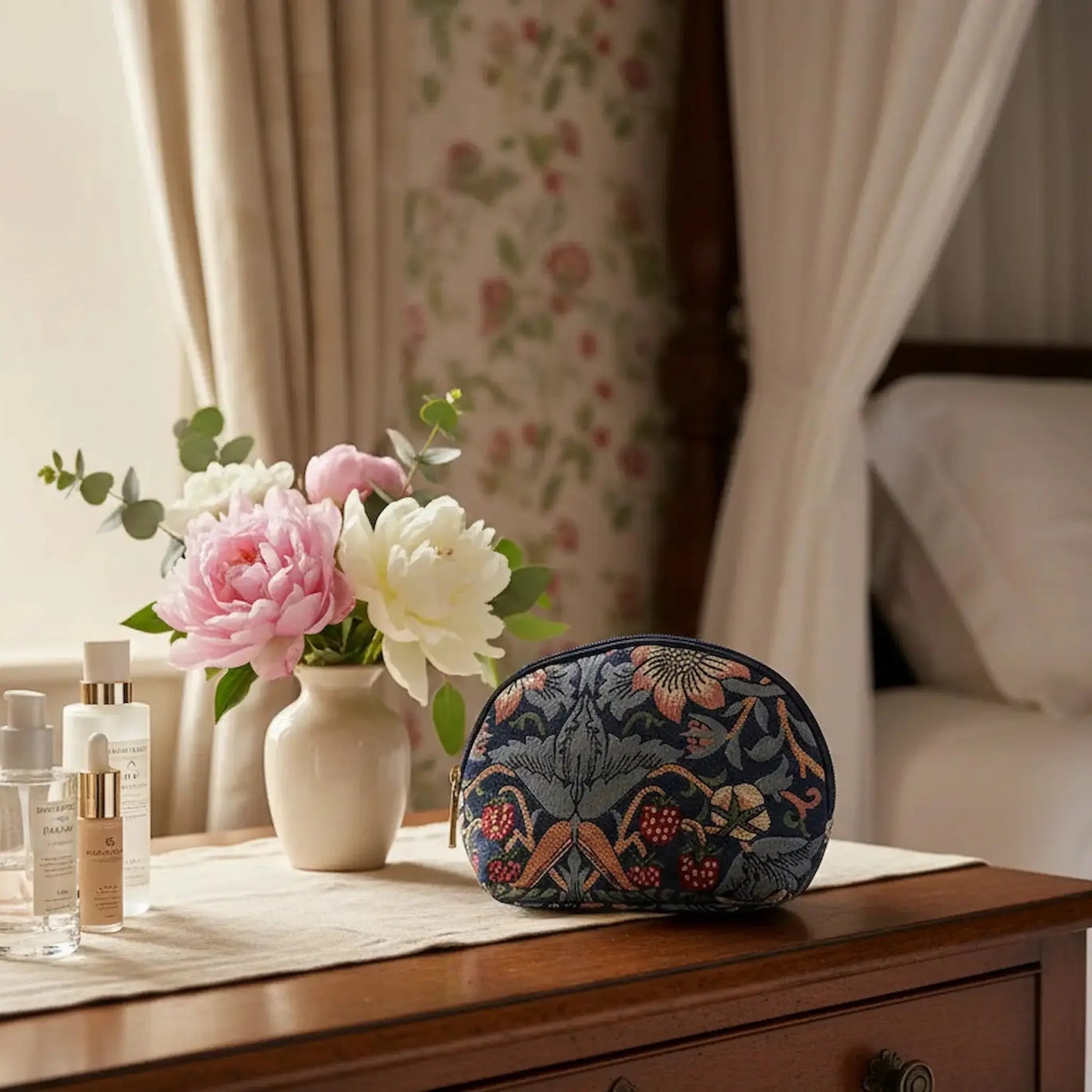 William Morris Strawberry Thief blue cosmetic bag UK on vintage dressing table beauty routine