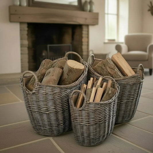 Wicker log basket beside fireplace in UK cottage living room with winter fireside storage charm