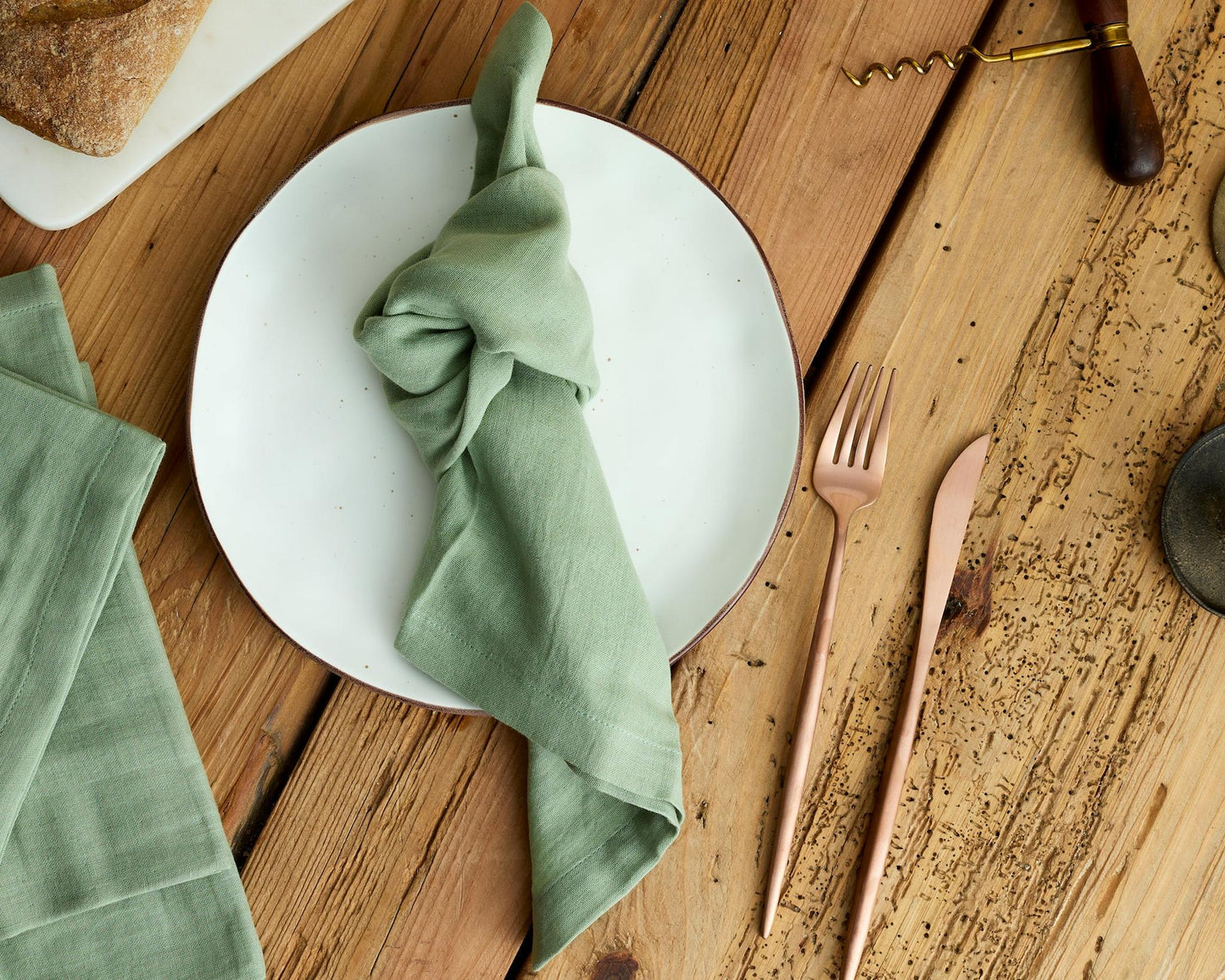 Close-up eco-friendly muslin cotton texture soft sage napkin heritage table linen UK