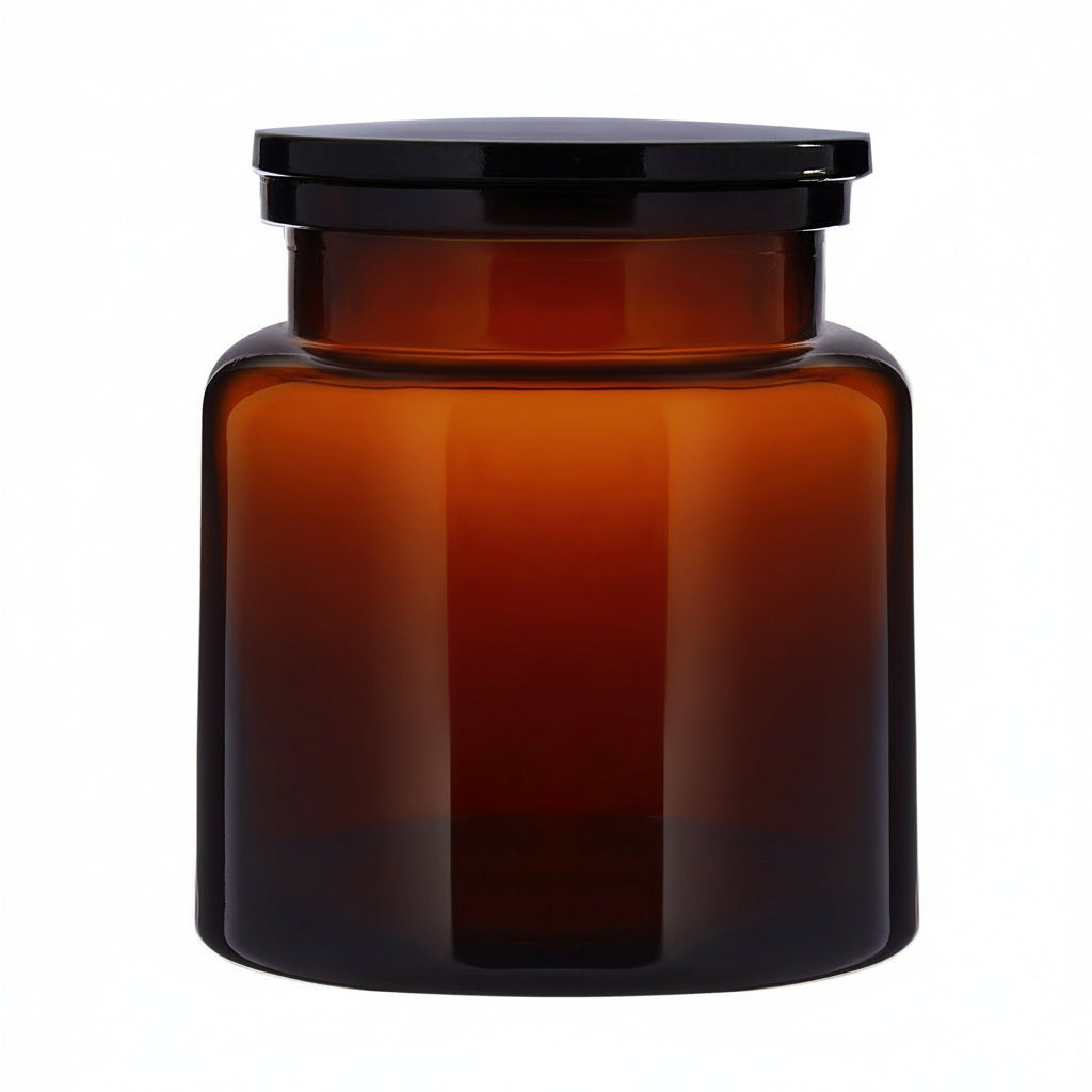 The Wetherby Amber Glass Storage Jar – small apothecary-style jar in translucent amber glass with wide-mouth design, styled for bath salts, cotton pads, or basin-side essentials.