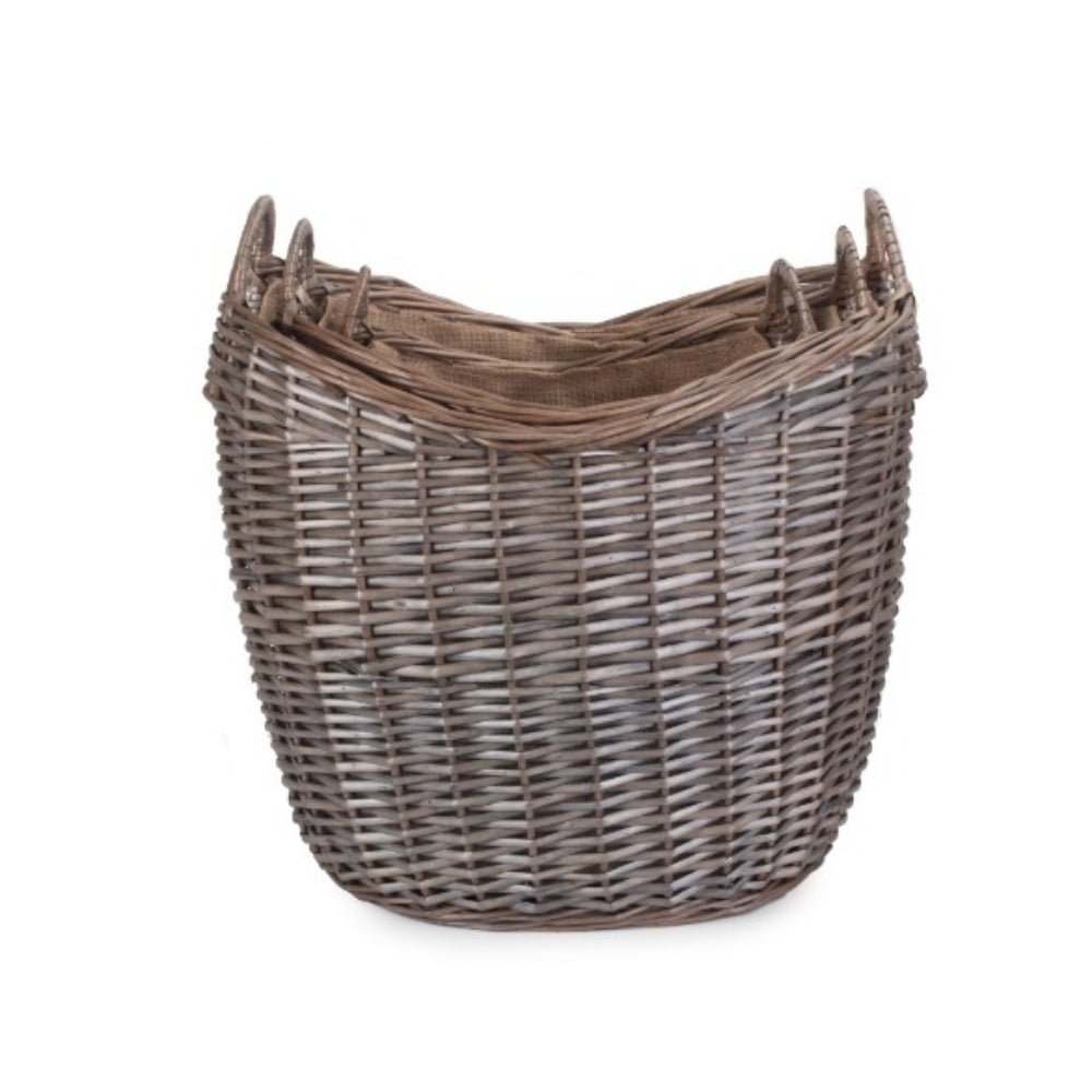 Three wicker log baskets with hessian lining, rustic fireside storage for countryside homes.
