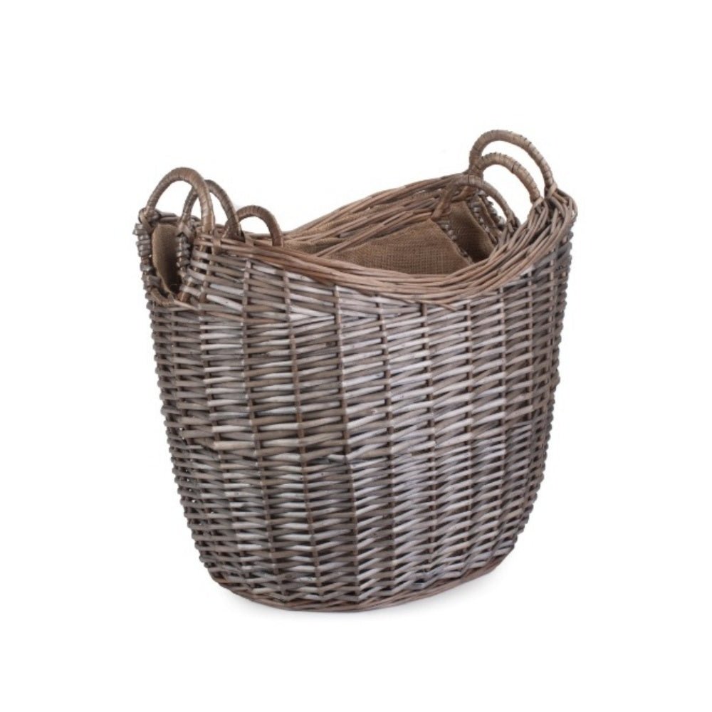 Set of 3 wicker log baskets with hessian lining, stacked for rustic, eco‑friendly fireside storage.