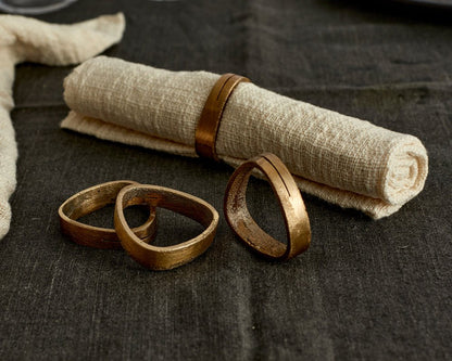 Agnes brass napkin rings set of 4 handcrafted table accents styled from another angle
