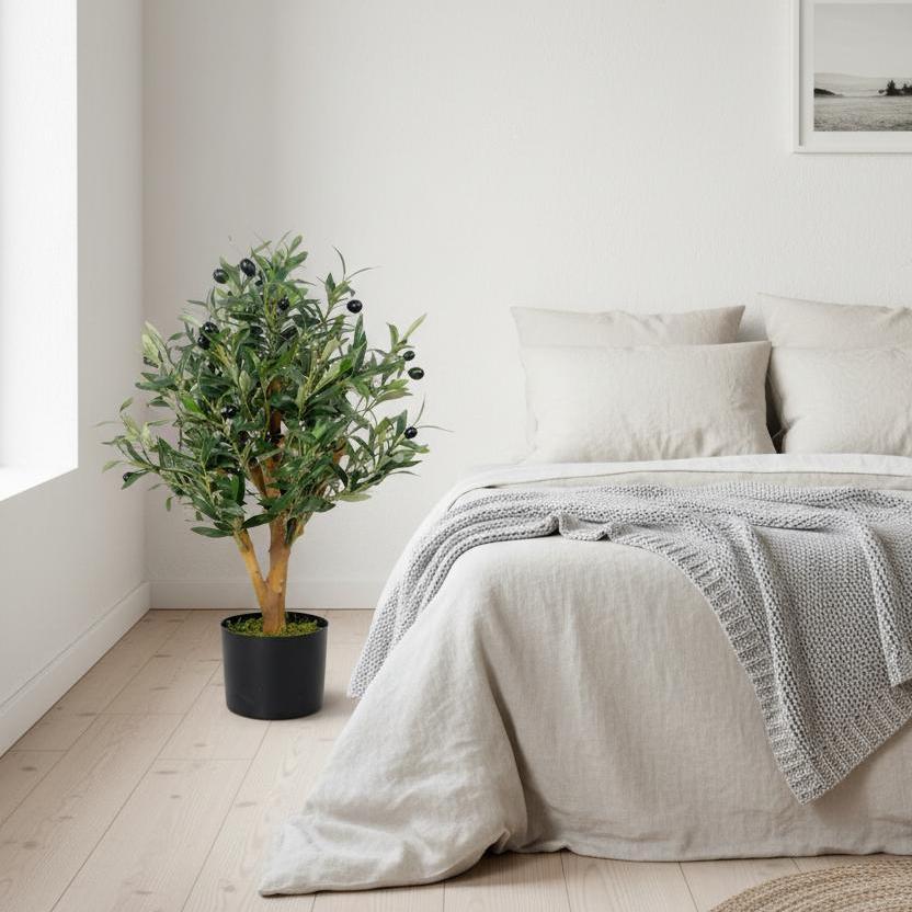 65cm faux olive tree styled in peaceful cottage bedroom corner with natural light