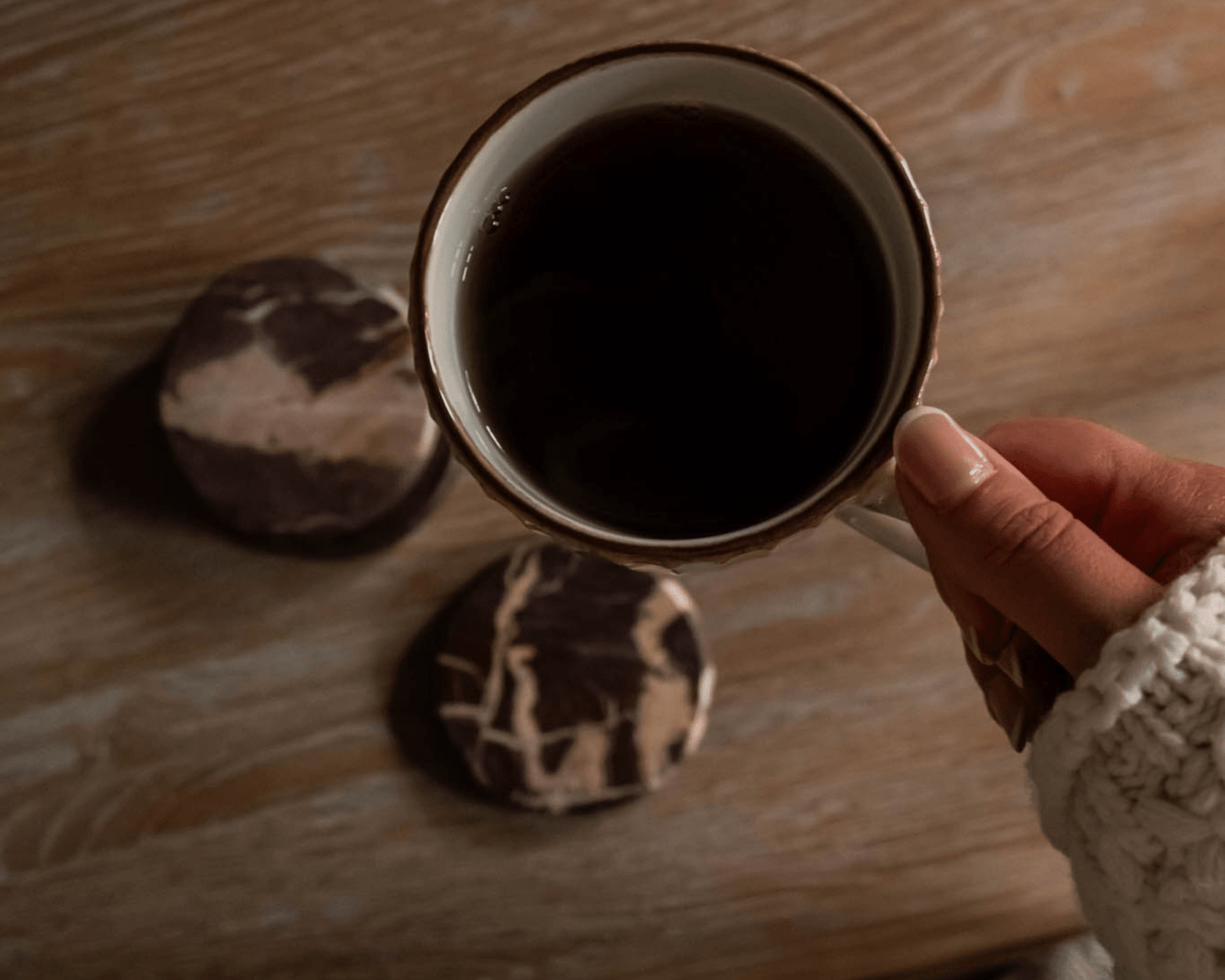 The Bramley burgundy marble coasters overhead view coffee mug cottage table UK