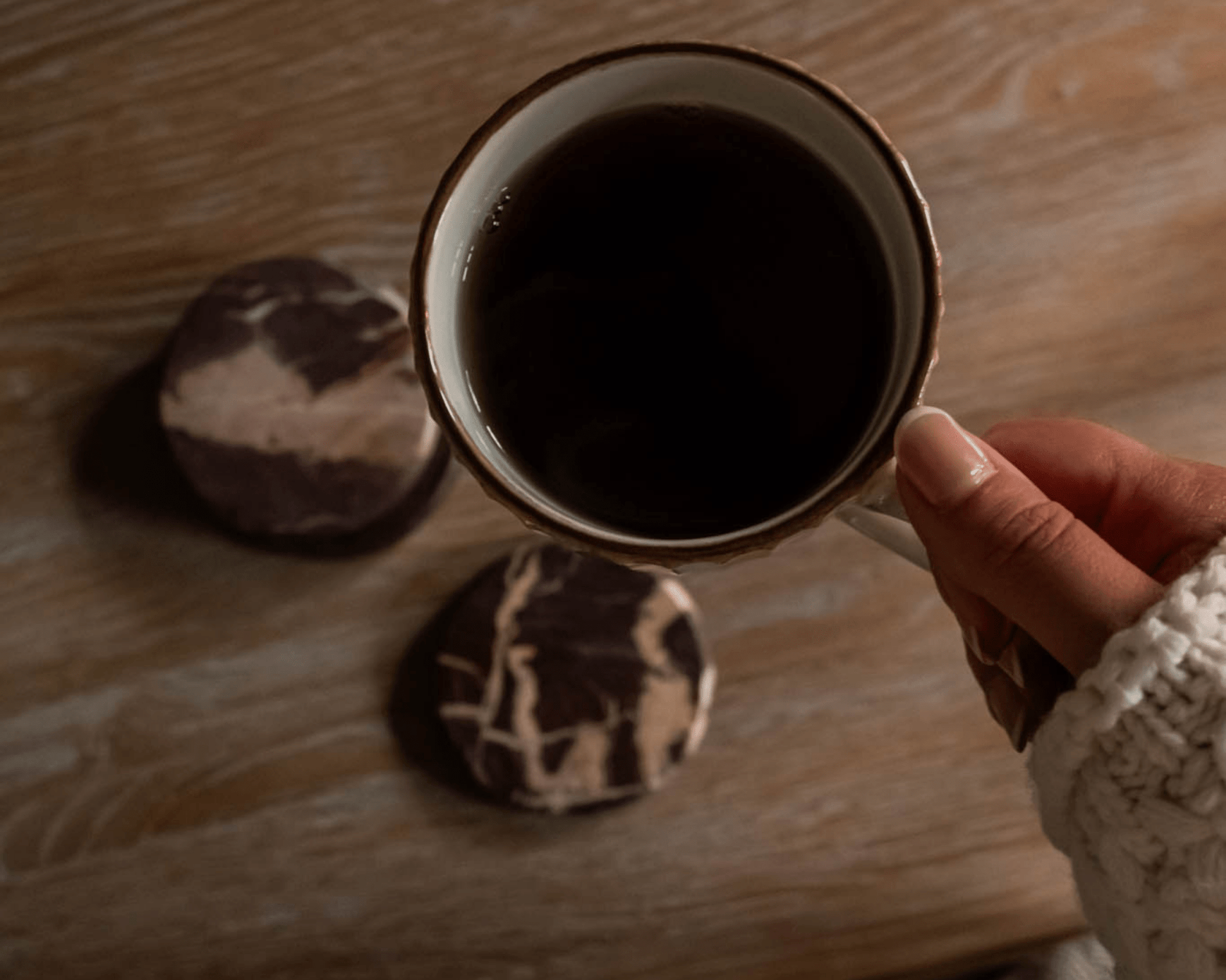 The Bramley burgundy marble coasters overhead view coffee mug cottage table UK