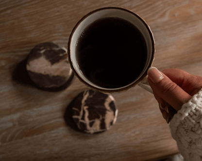 The Bramley burgundy marble coasters overhead view coffee mug cottage table UK