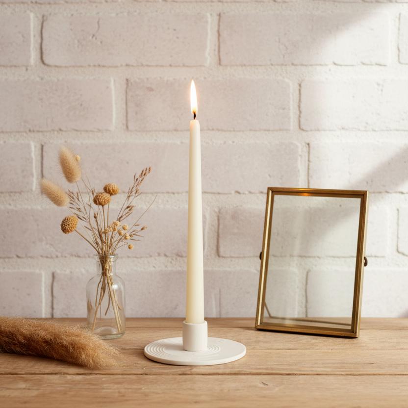 White ceramic candle holder lit taper candle period property mantel UK cottage
