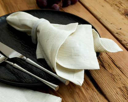Chelsea Marble Napkin Ring polished natural stone displayed on black plate with napkin in one