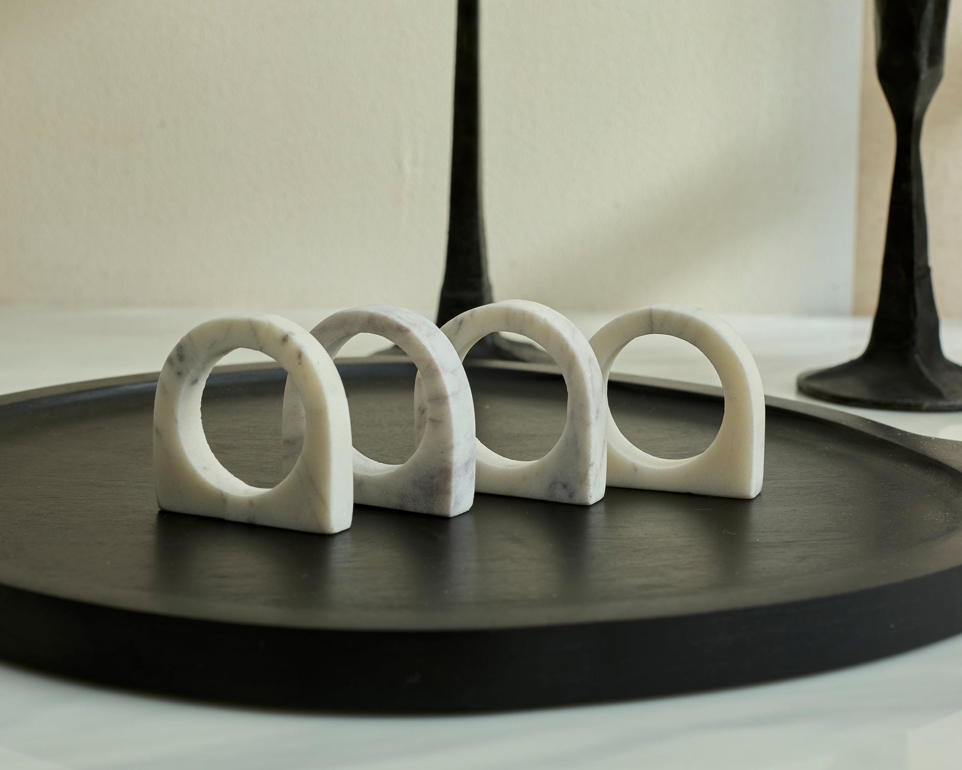 Chelsea Marble Napkin Rings polished natural stone set displayed on black serving board