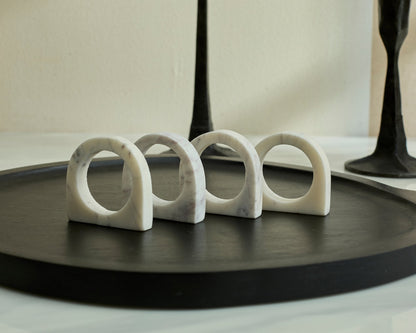 Chelsea Marble Napkin Rings polished natural stone set displayed on black serving board