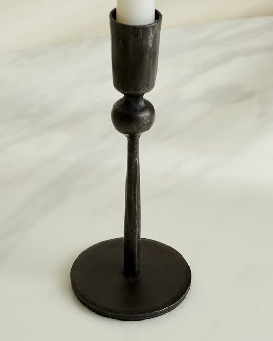 Black iron candlestick close-up matte texture solid construction UK