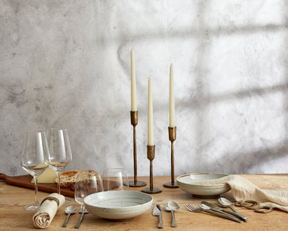 The Elmsley brass napkin rings set of 4 styled on a set dining table
