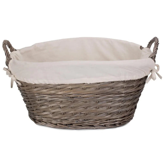 Wicker laundry basket with white fabric lining and twisted rope handles on white background