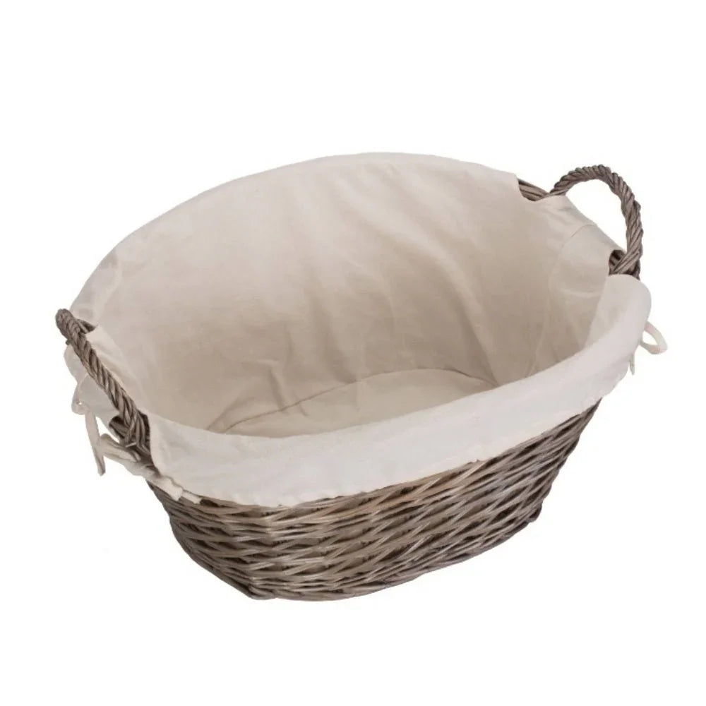 Wicker laundry basket with beige fabric liner and rope handles on white background