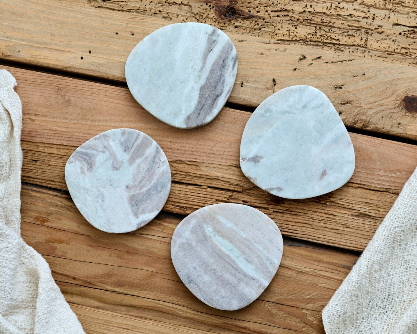 Hartley marble coasters set of 4 artisan design laid out wooden table entertaining UK