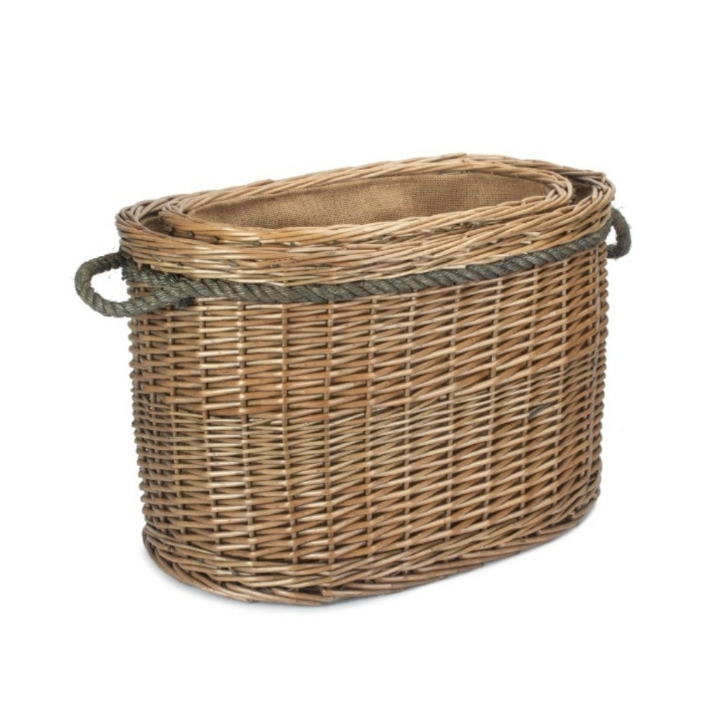 Two oval wicker log baskets stacked set inside rope handles plain background nested UK