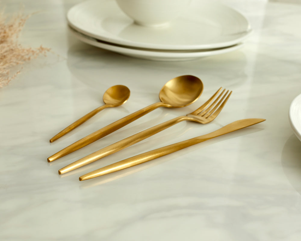 Luxury gold cutlery set 18/8 stainless steel on marble table UK elegant dining
