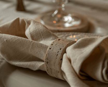 Close up of Langley travertine napkin ring artisan stone accent styled on plate
