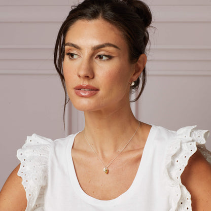 Model wearing Laura Ashley Broadoak Acorn Necklace sterling silver yellow gold UK
