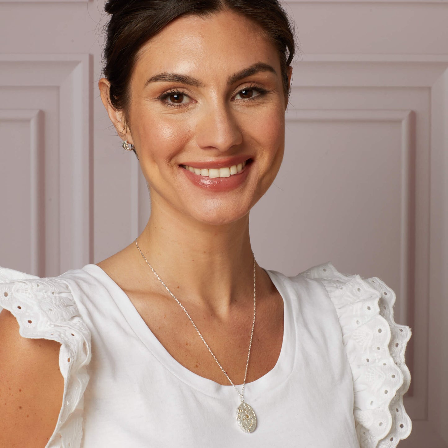 Model wearing Laura Ashley Broadoak mini hoop earrings sterling silver UK
