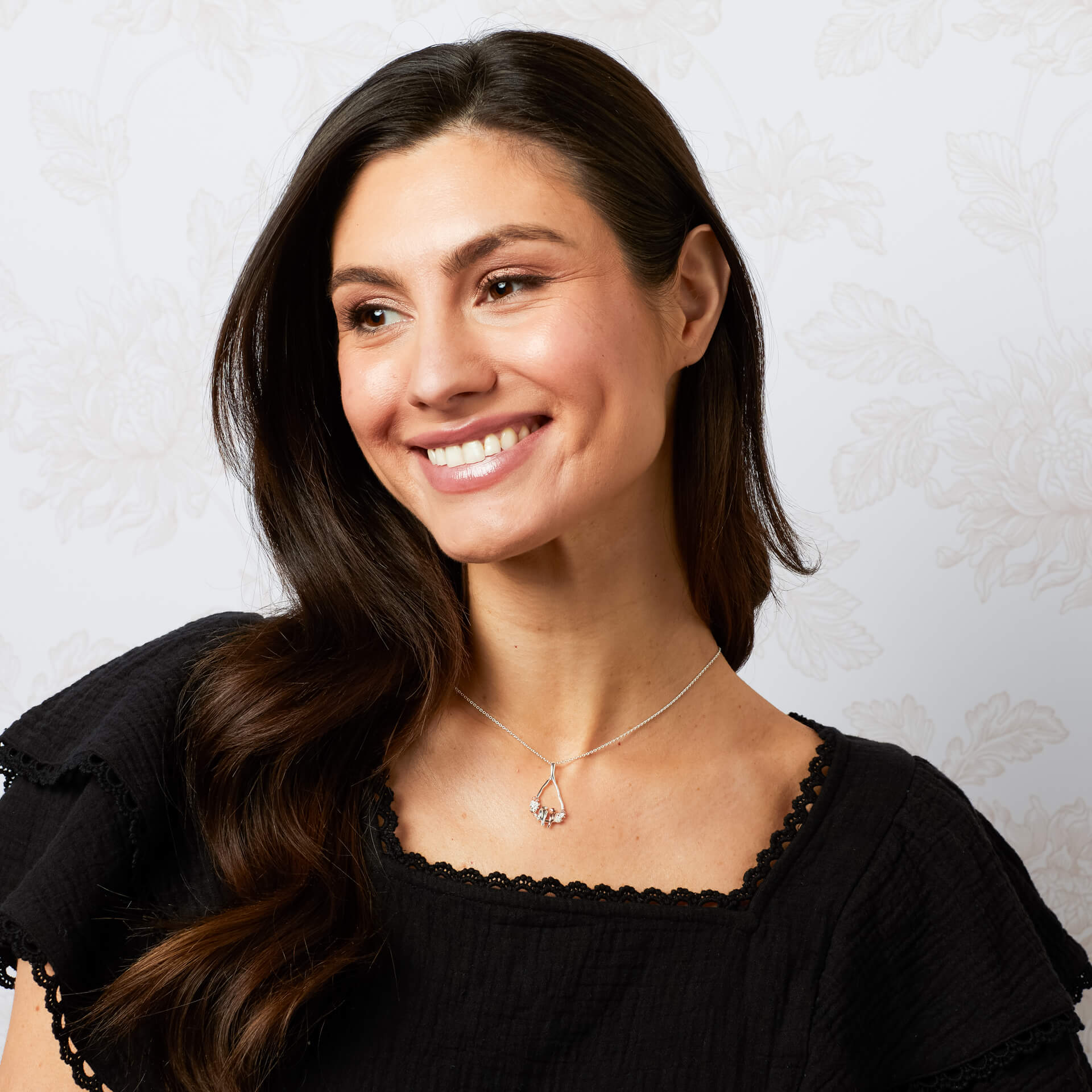 Model wearing Laura Ashley love birds sterling silver rose gold necklace UK
