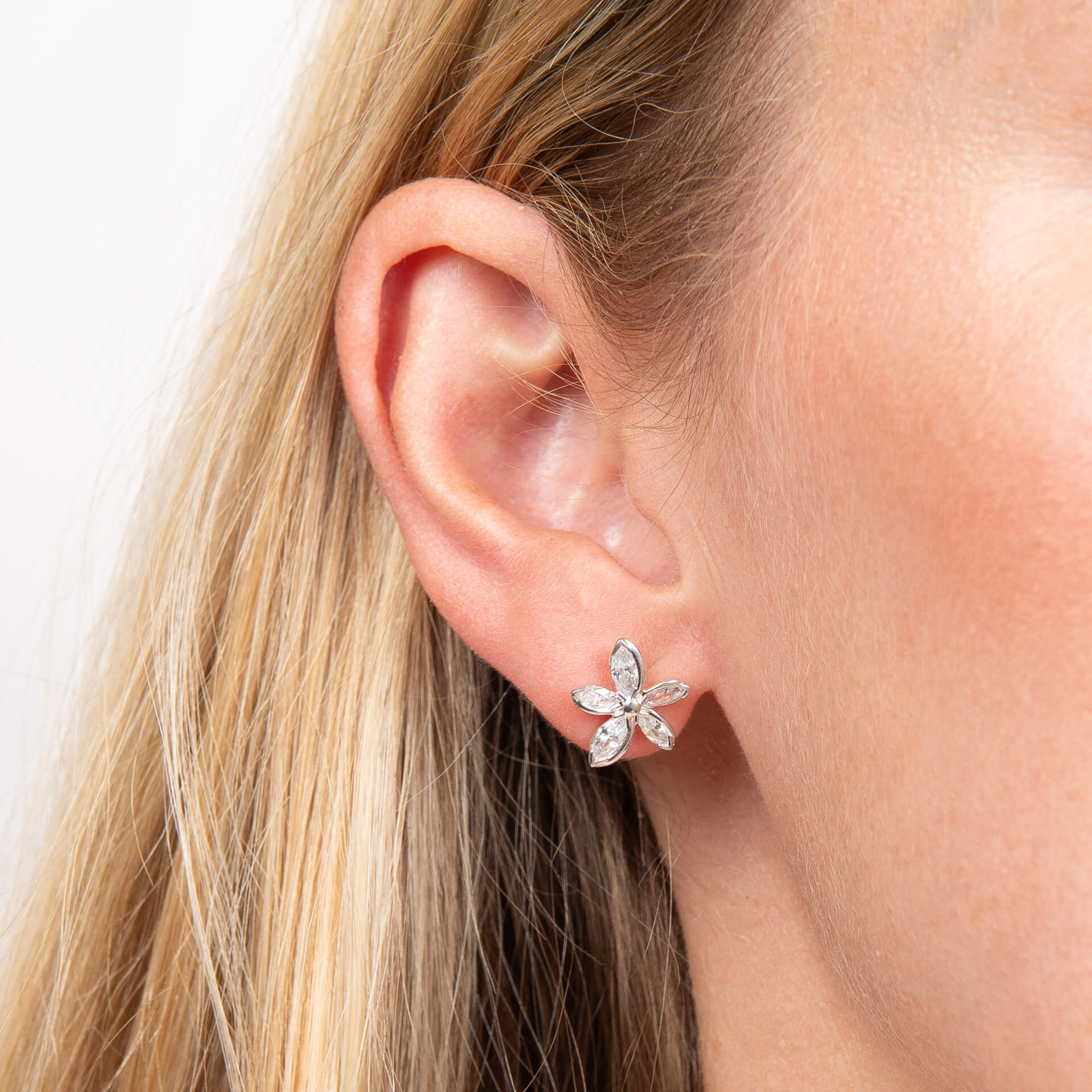 Laura Ashley Tumbling Floral stud earrings worn in model's ear silver plated UK