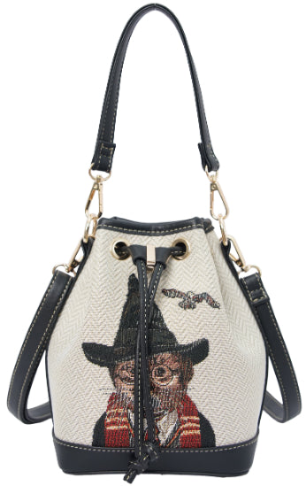 Front view of magical cat tapestry bucket bag with vegan leather trim on plain blank background