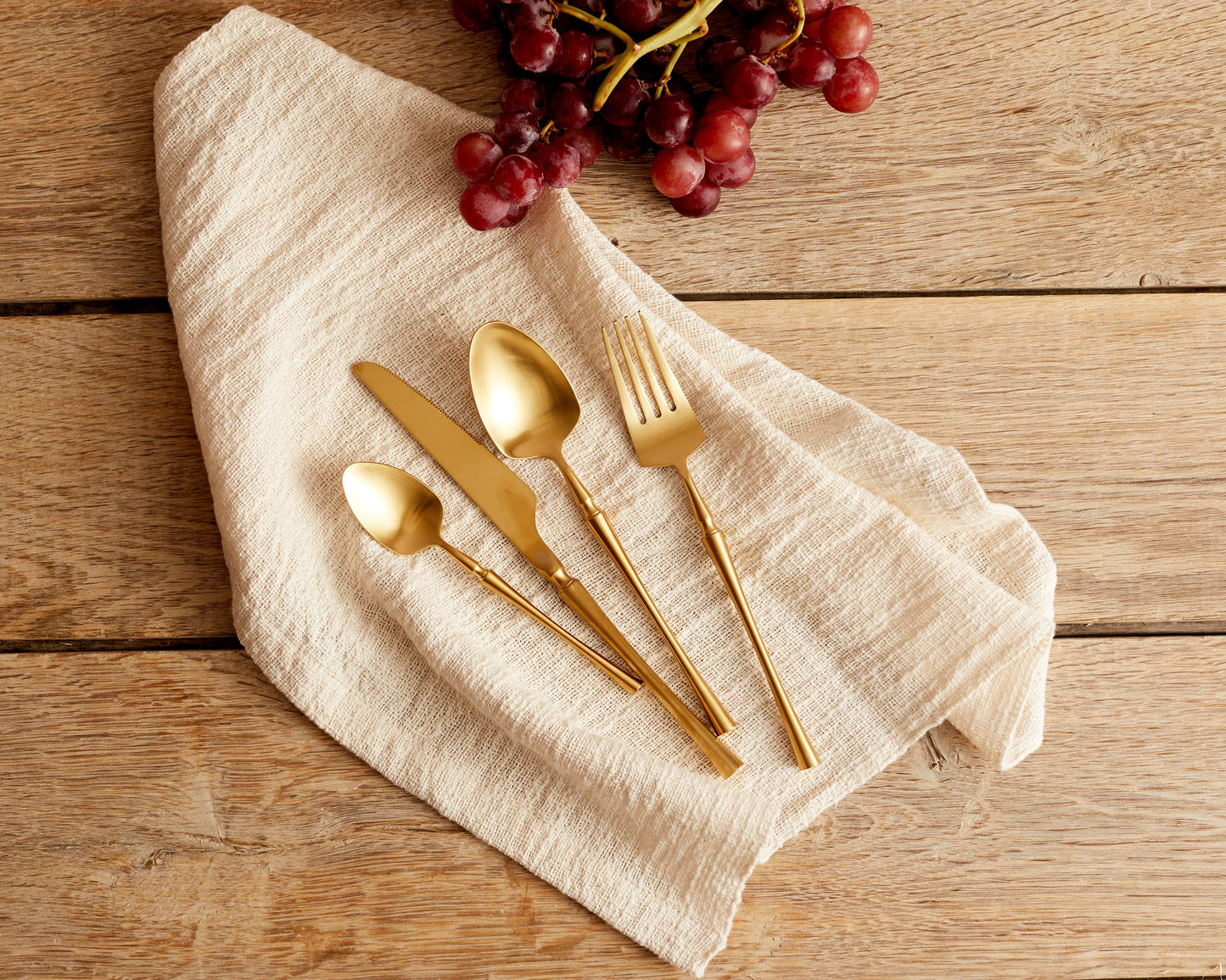 Kensington matte gold cutlery set 16 24 piece flatware on linen napkin UK