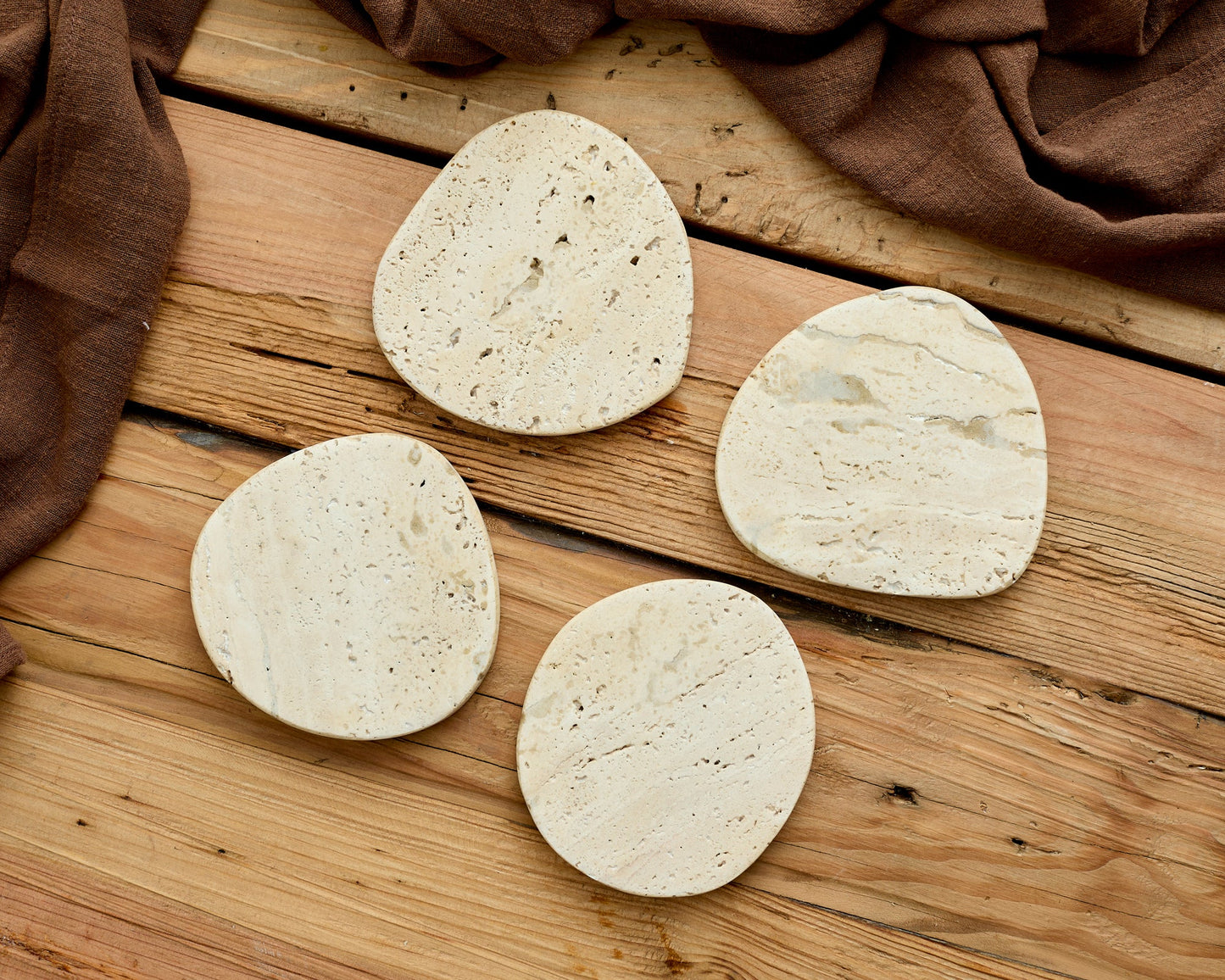 Natural travertine coasters protecting coffee table heritage UK homeware artisan craftsmanship