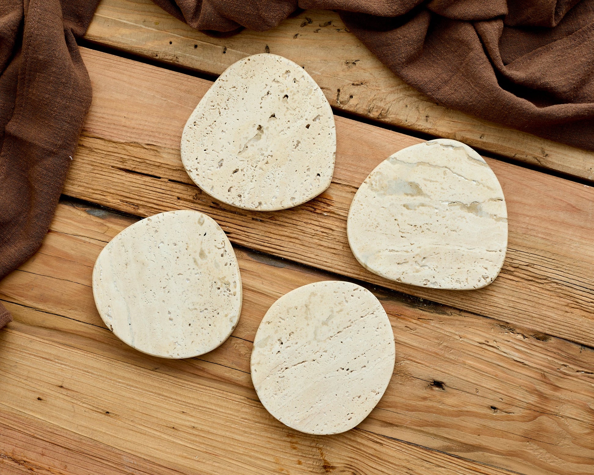 Natural travertine coasters protecting coffee table heritage UK homeware artisan craftsmanship