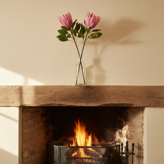 Pink protea stems mantelpiece cottage living room UK country home decor