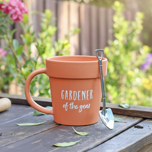Plant pot mug held by gardener in gloves outdoor garden gift UK