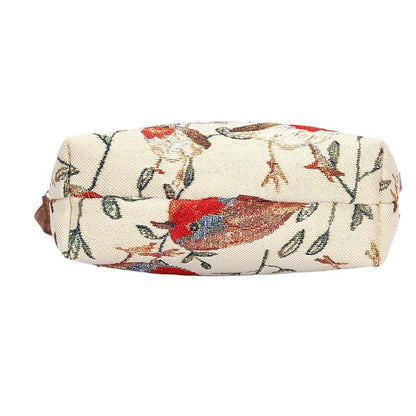 Bottom view of Robin sling bag in tapestry fabric showing structured base, zip closure and vegan leather trim in warm woodland tones