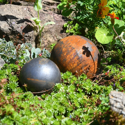 Rusted steel garden balls greenery weathered spheres countryside gift UK trio

