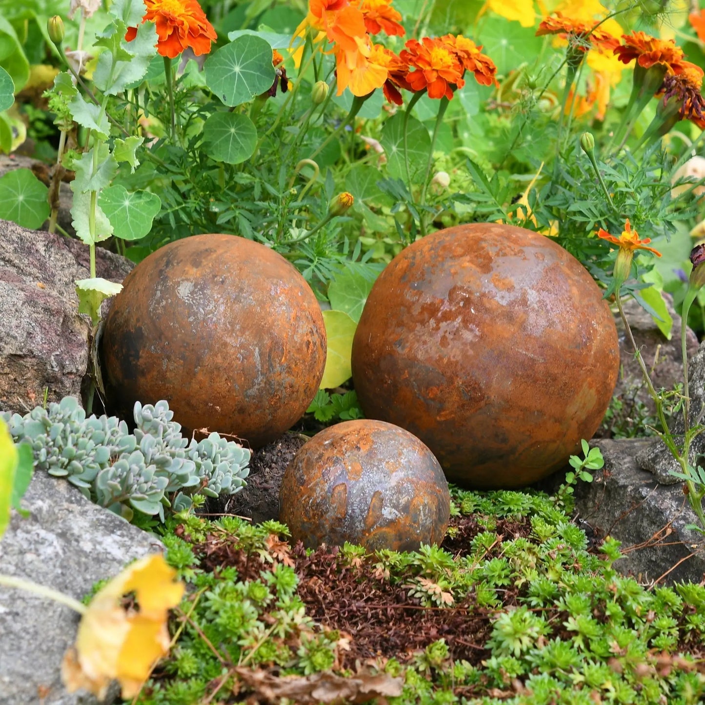 Rusted garden ball trio gift UK steel spheres heritage cottage garden sculpture
