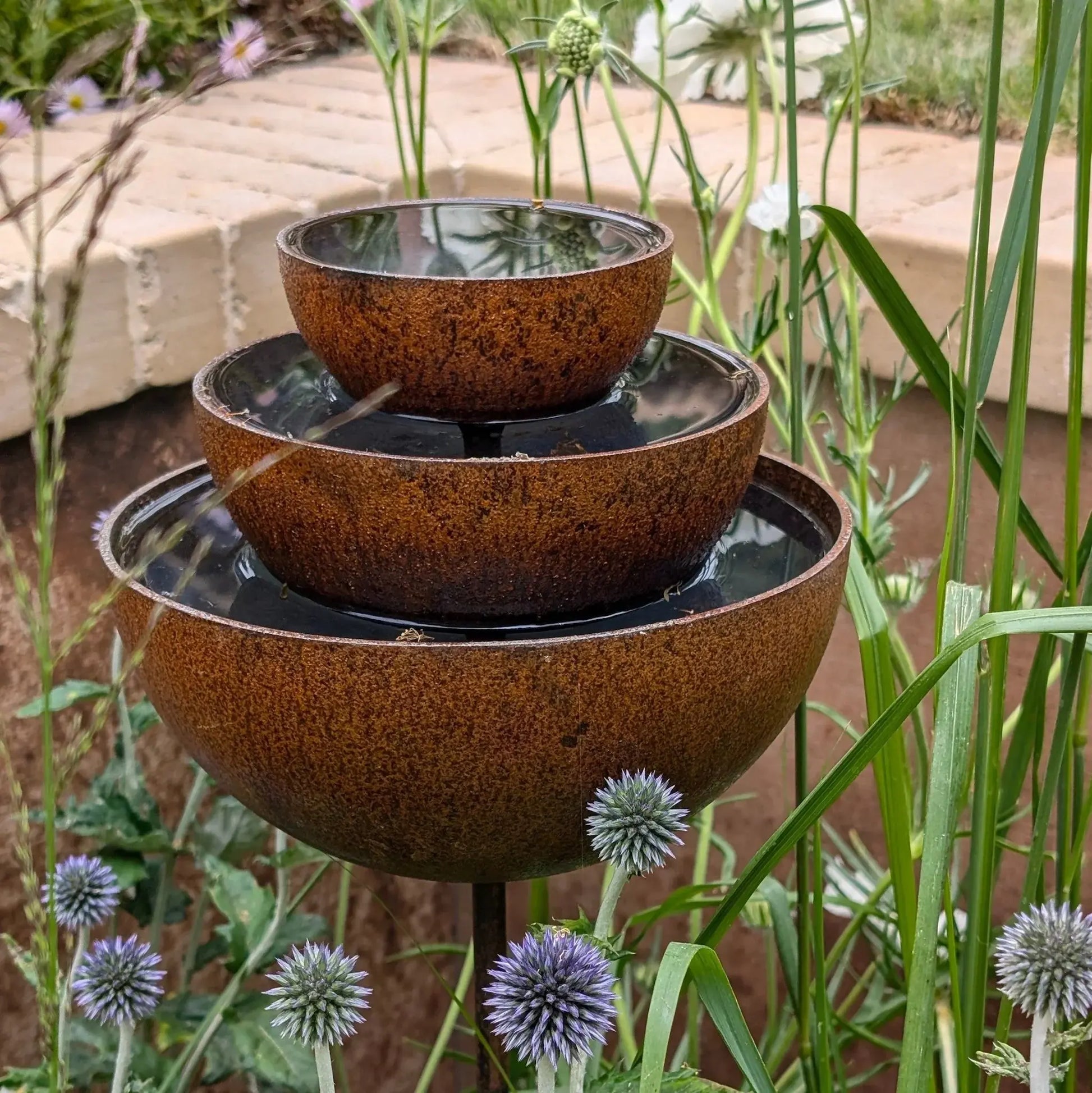 Rusted garden fountain stake 100cm three-tier rain catcher purple thistle cottage garden UK