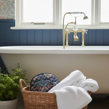 Strawberry Thief blue tapestry cosmetic bag UK in heritage bathroom spa styling wicker basket
