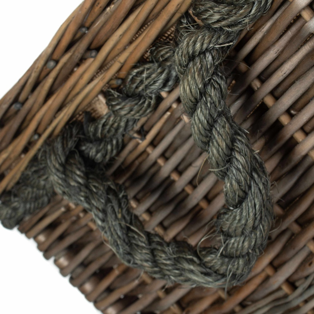 Close view of rope handle on Thornleigh square wicker log basket, handwoven fireside storage detail