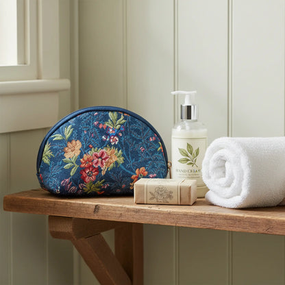 V&A Flower Meadow Blue cosmetic bag on bathroom shelf heritage tapestry makeup organiser UK