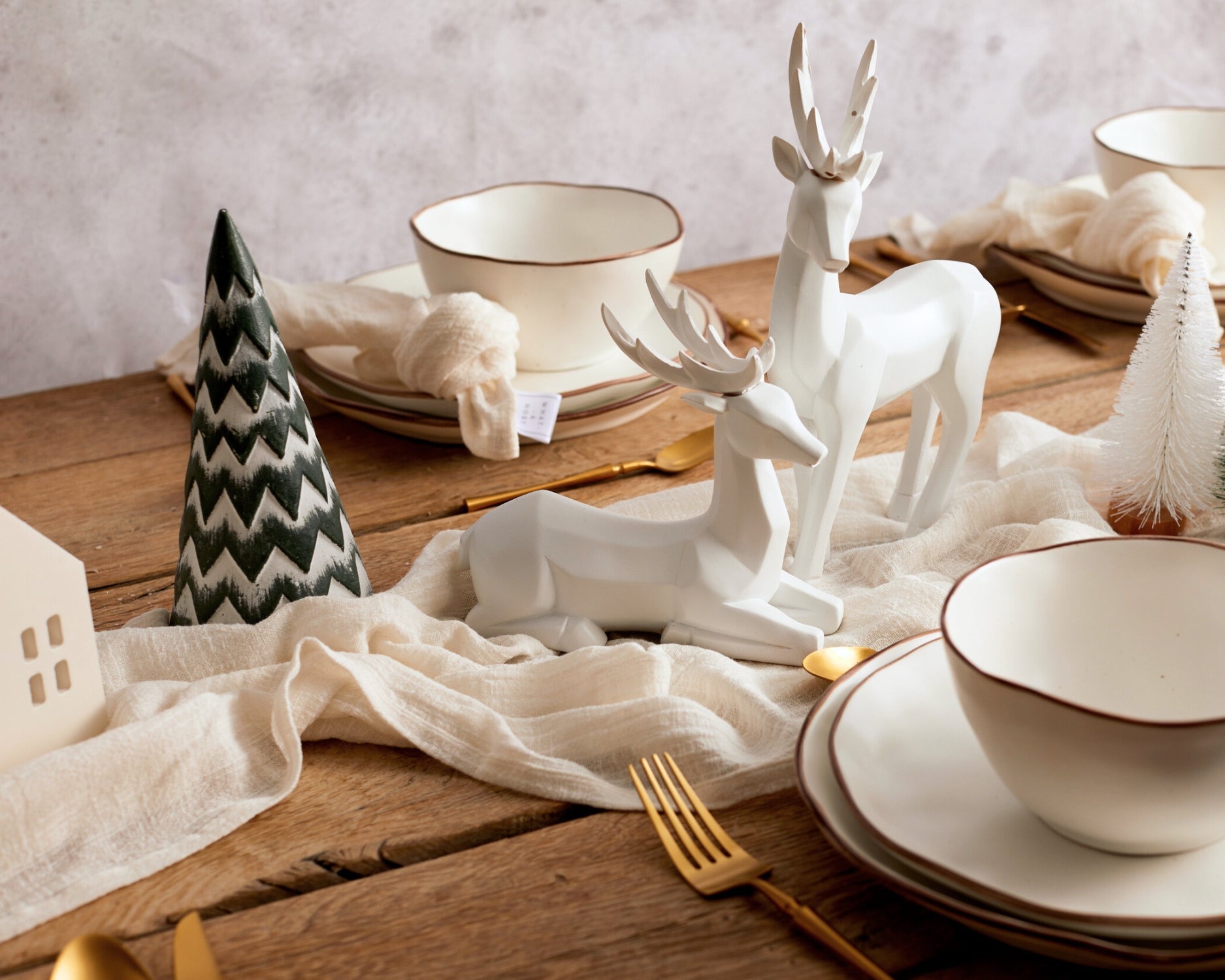 Whisper of Snow wooden Christmas tree rustic festive decor UK styled on table within a festive tablescape
