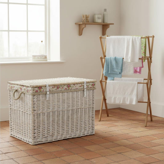 Whitewash wicker laundry basket in country utility room - heritage storage UK