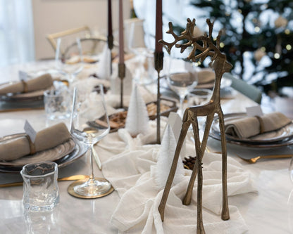 Wickham gold reindeer ornament festive mantel decor UK styled within festive tablescape
